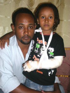 Berhanu and his son Dawit, who was injured during a kidnapping attempt in Uganda. Berhanu and his son Dawit, who was injured during a kidnapping attempt in Uganda.