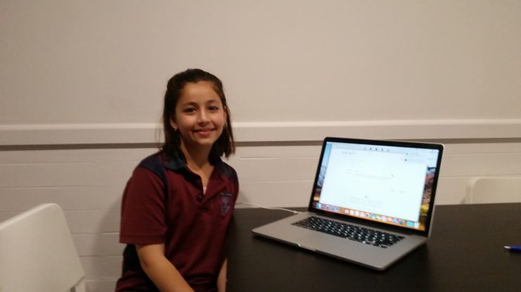 Girl receives a laptop donation from Sanctuary